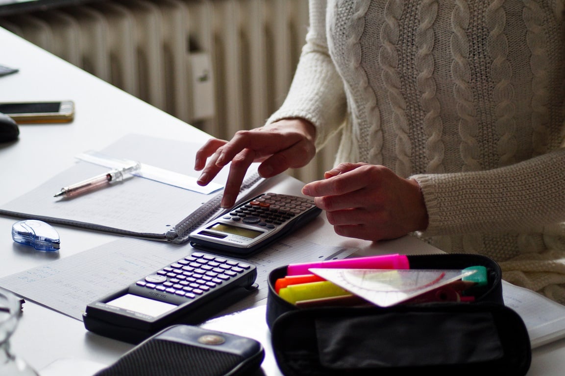 Photo of desk with calculators, Toad for Oracle code testing.