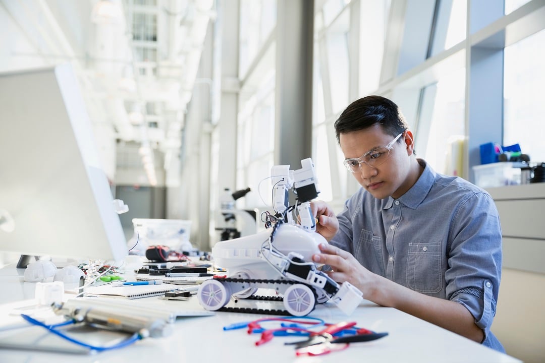 Man working on computerized robot. Feeding your database: Different techniques for automating Excel imports